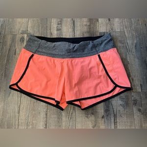 Lululemon women’s peach pink grey shorts 4” inseam size 10